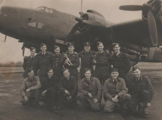Henry Sturrock (top left) with his bomber crew in front of their aircraft, 1940s