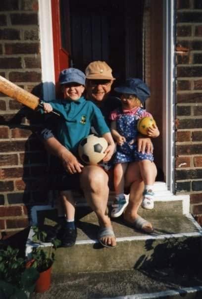 Me and my sister Jenny with Grandy on the garden steps